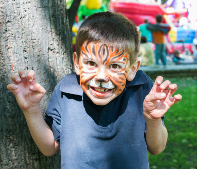 A boy with tiger face paint